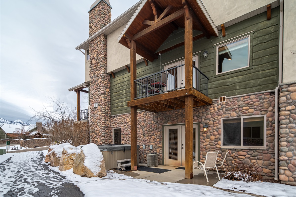 Exterior view showcasing rustic stone and timber details