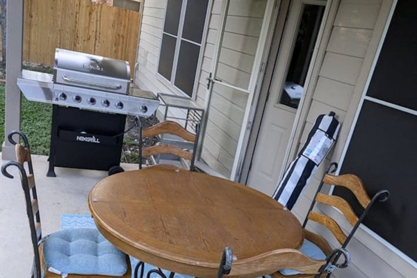 Private patio dining for 4 with outdoor furniture, BBQ grill, and a charming atmosphere for morning coffee or evening dinner outdoors.