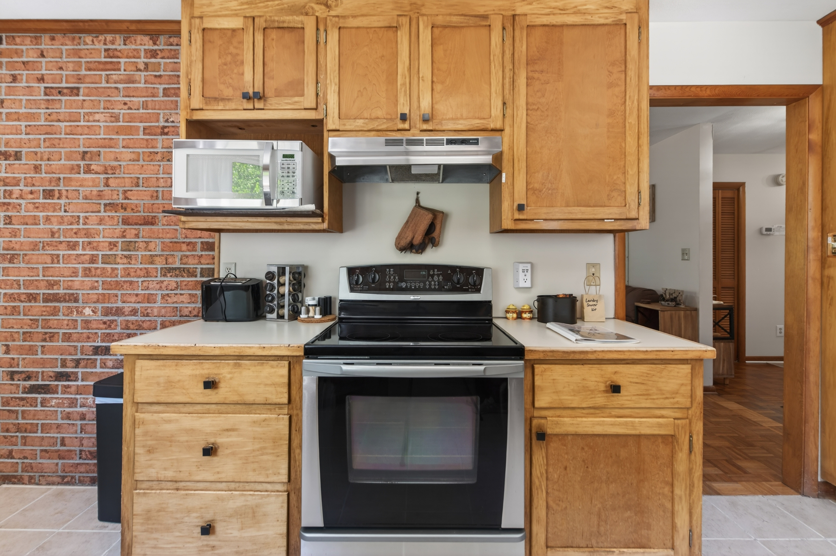 Kitchen: Modern appliances meet rustic charm in this inviting culinary space!