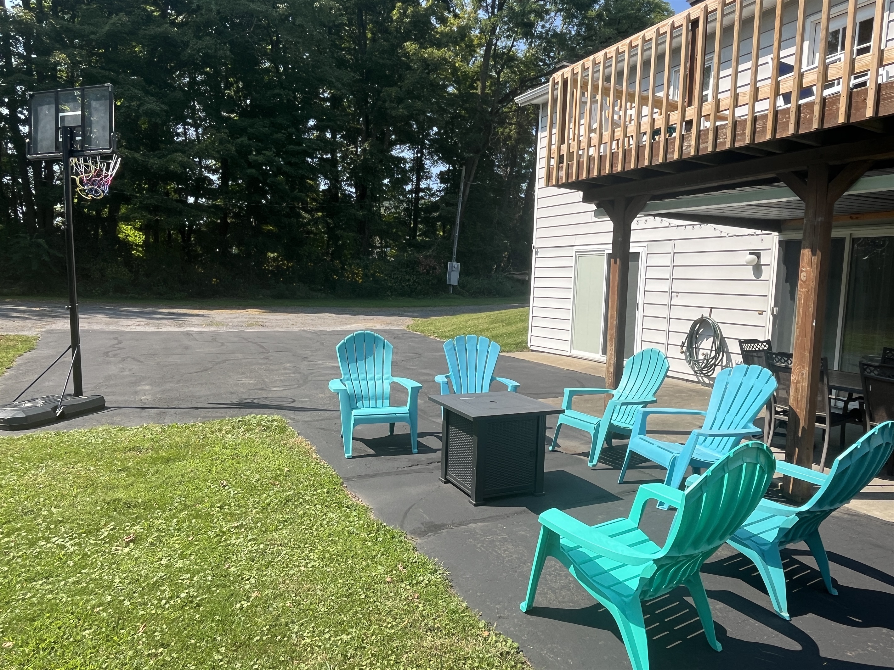 Basketball and patio area with firetable
