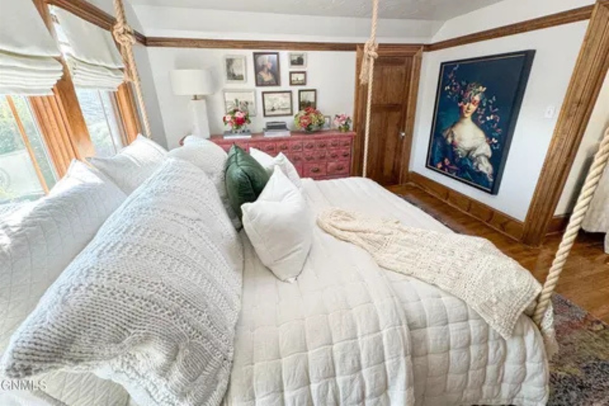 This room feels warm and inviting, with a bed you’ll want to sink right into.