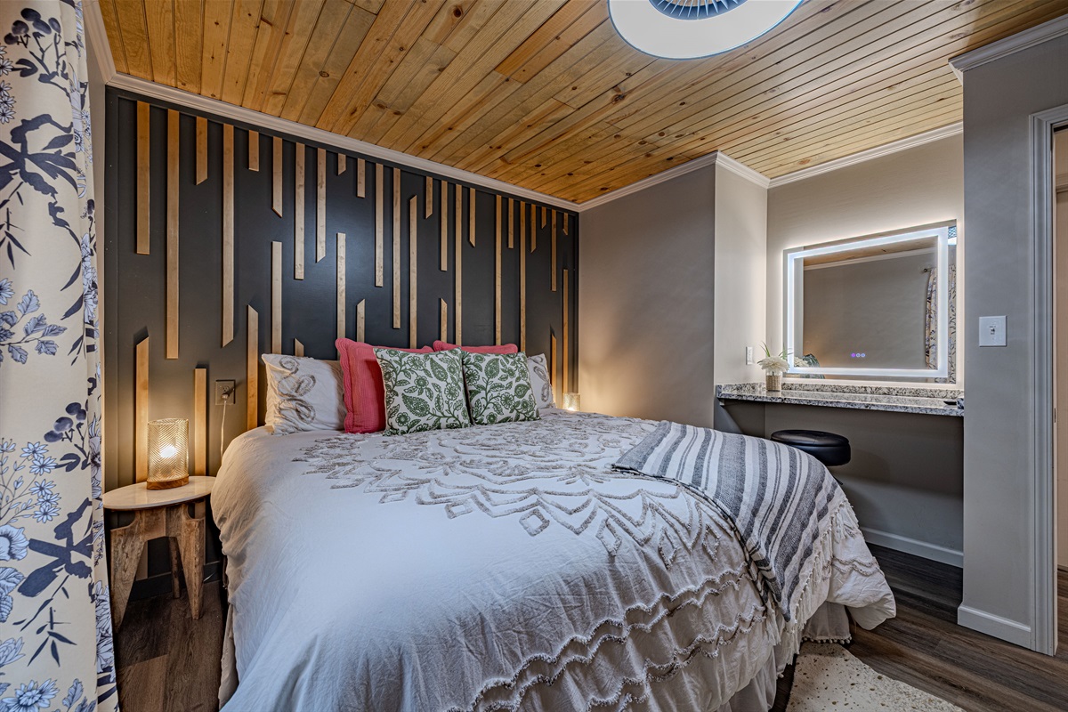 Sleep well surrounded by unique design, a stunning accent wall, and a luxurious duvet.