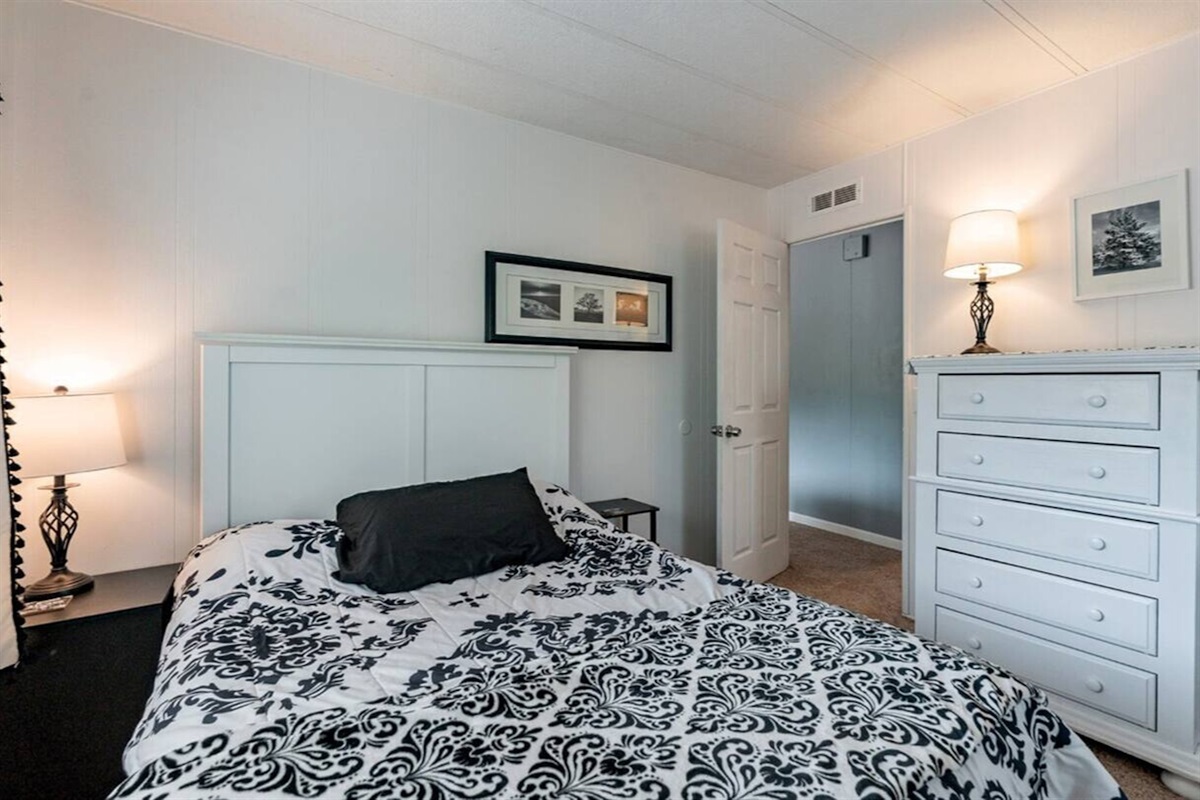 Cozy retreat with crisp linens and warm lighting for restful nights.