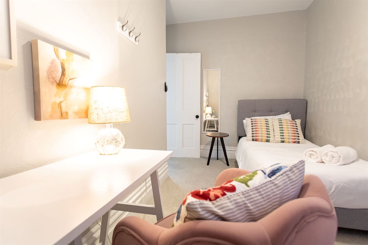 Should you have remote-work needs, you’ll find a comfy chair with desk in the second floor’s cozy Twin Room.