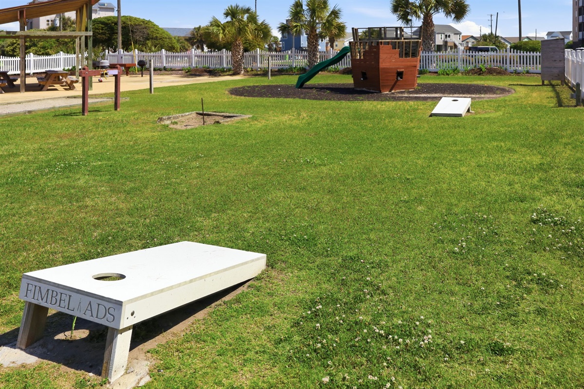 Family-friendly outdoor area with cornhole and lawn games