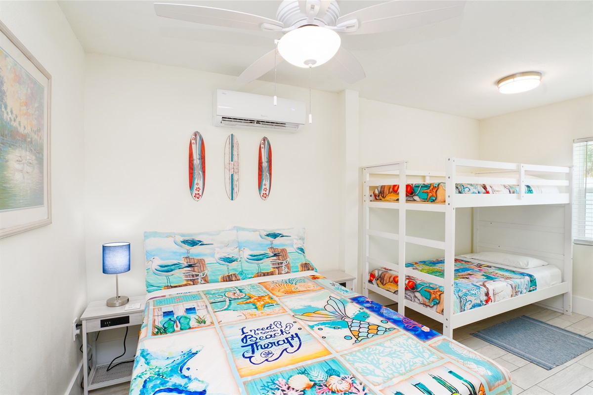 Unit B's bunk room offers a double bed, two twin beds and a smart TV.
