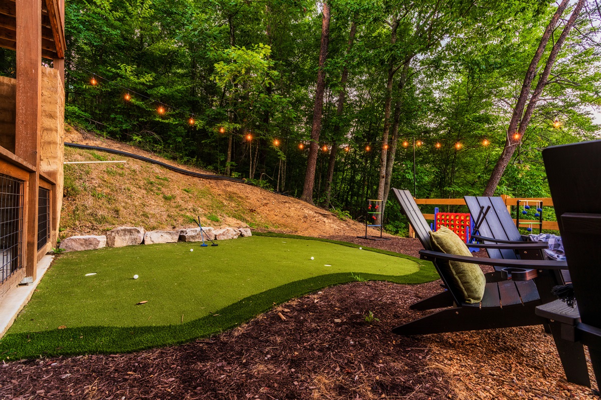 Backyard with mini golf, fire, pit, string lights & outdoor games