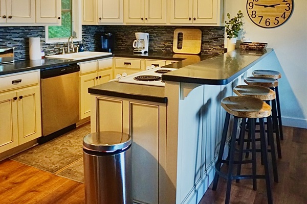 Kitchen Oasis: Enjoy cooking in this stylish kitchen with modern appliances and inviting bar seating!