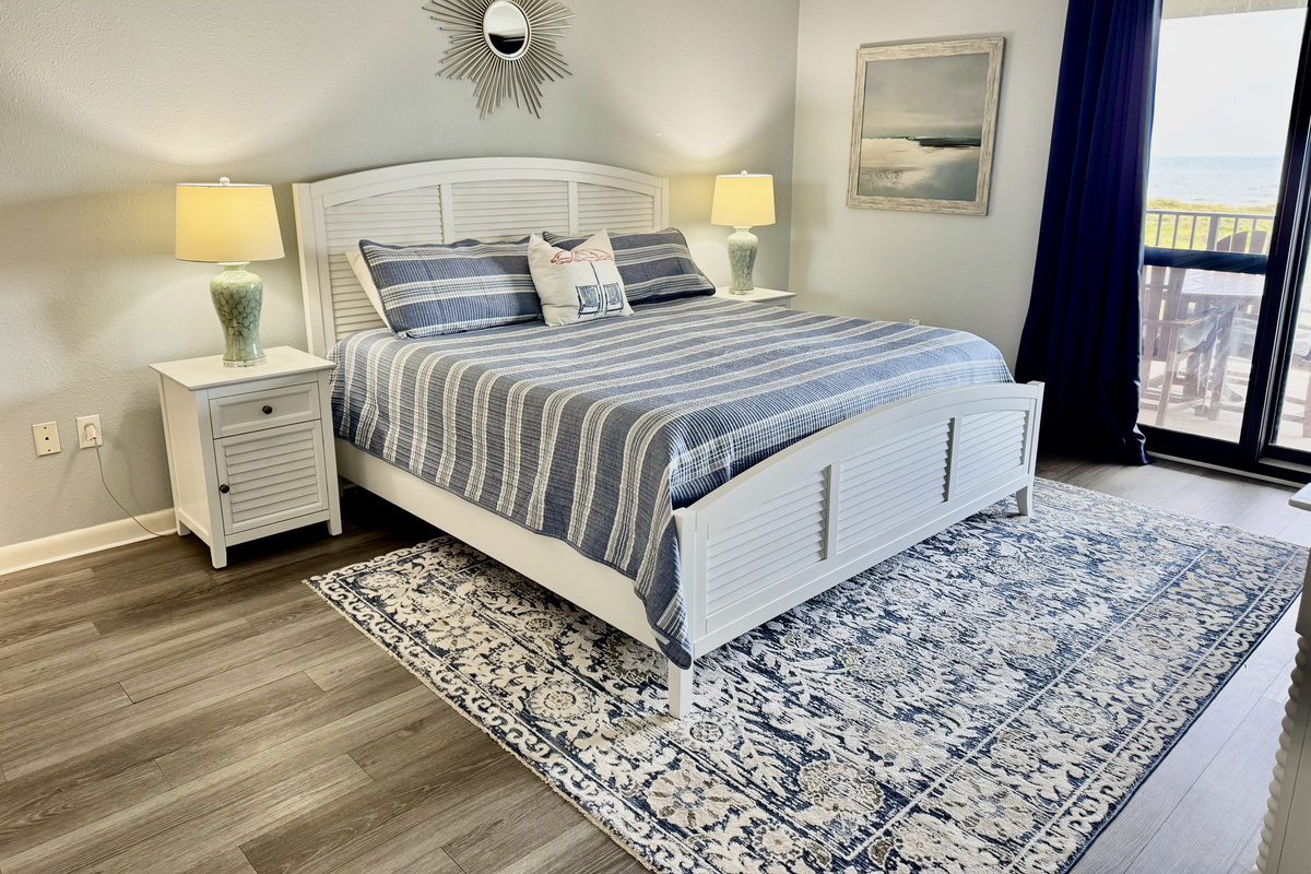 The master has a king-sized bed for ultimate relaxation!  And, there is an entrance to the gulf-front balcony from this room!