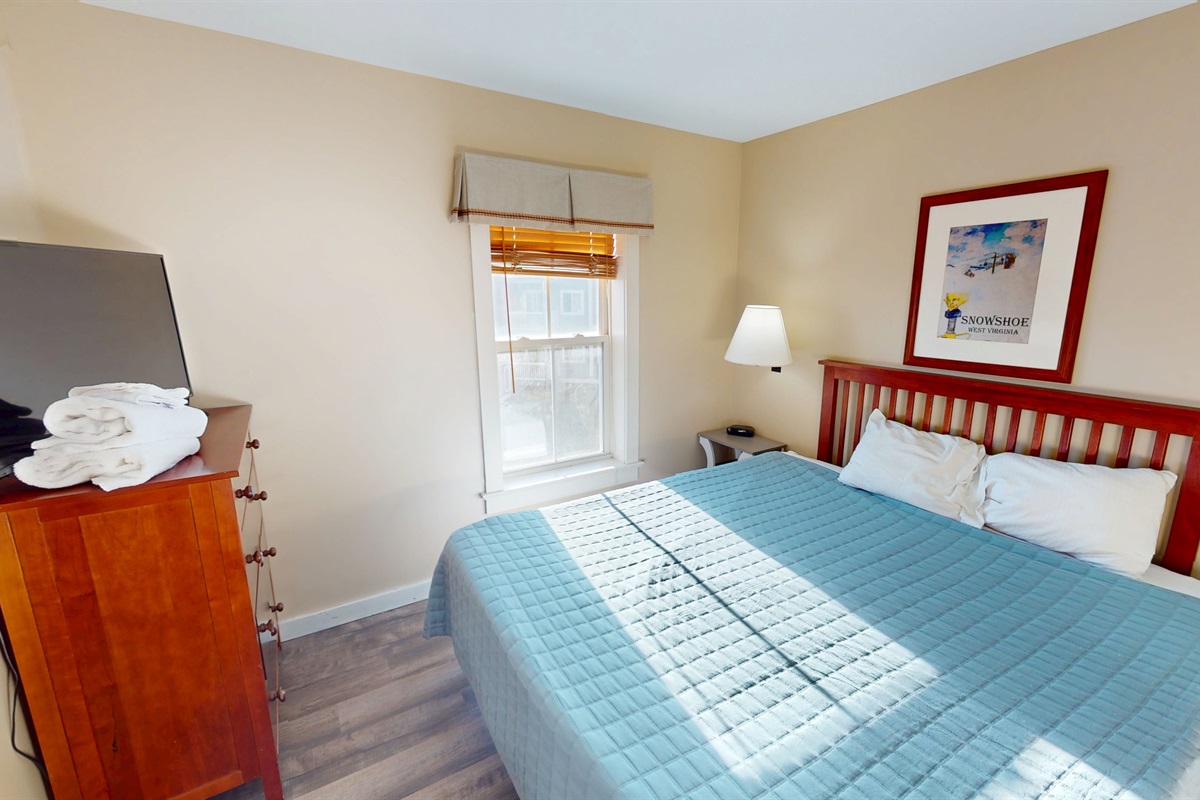 Sunlit bedrooms with classic mountain décor and ample storage.