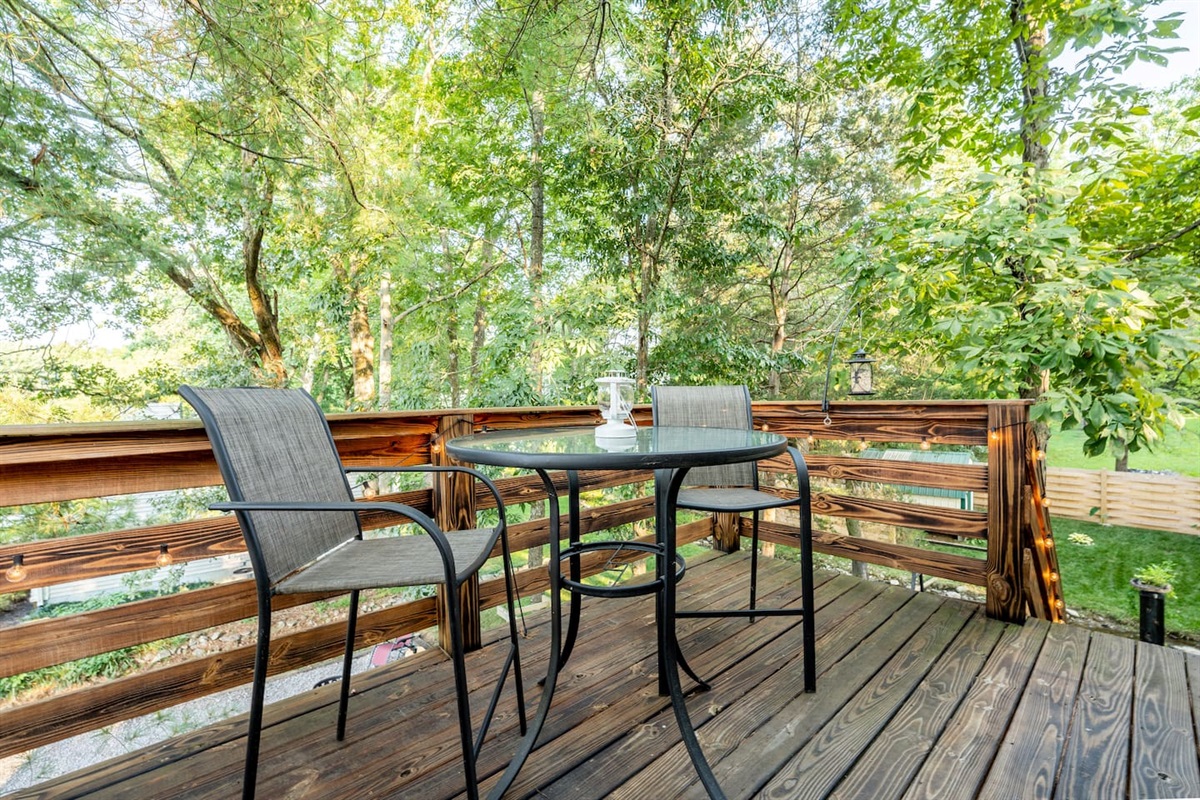 Upper deck seating great for relaxing up in the surrounding trees. 