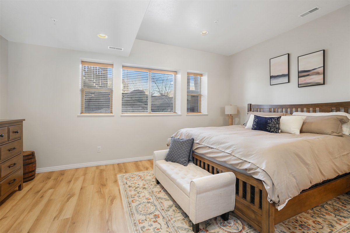 Primary bedroom with a king bed—spacious, bright, and designed for a great night’s sleep.