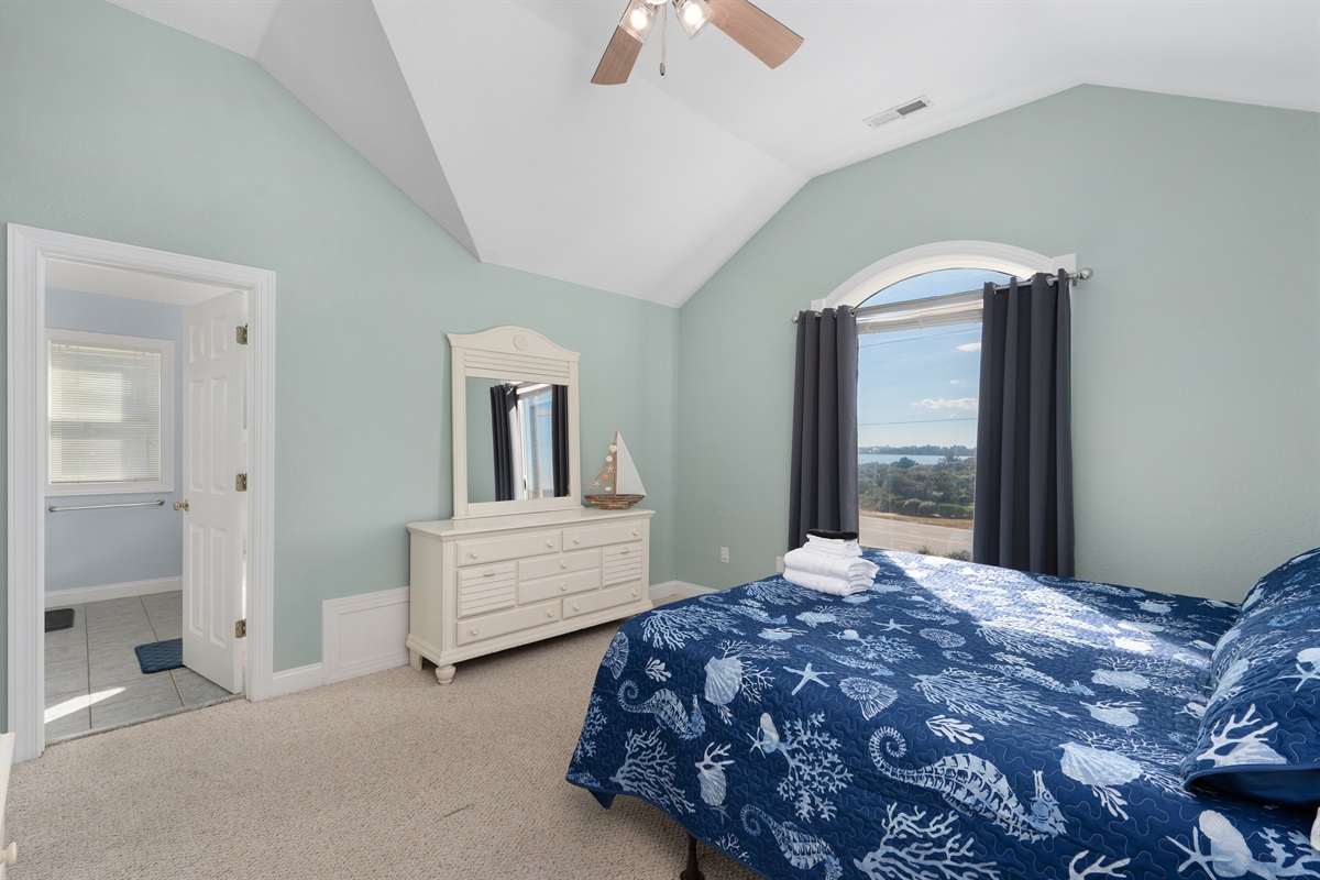 Top-level King bedroom filled with natural light.