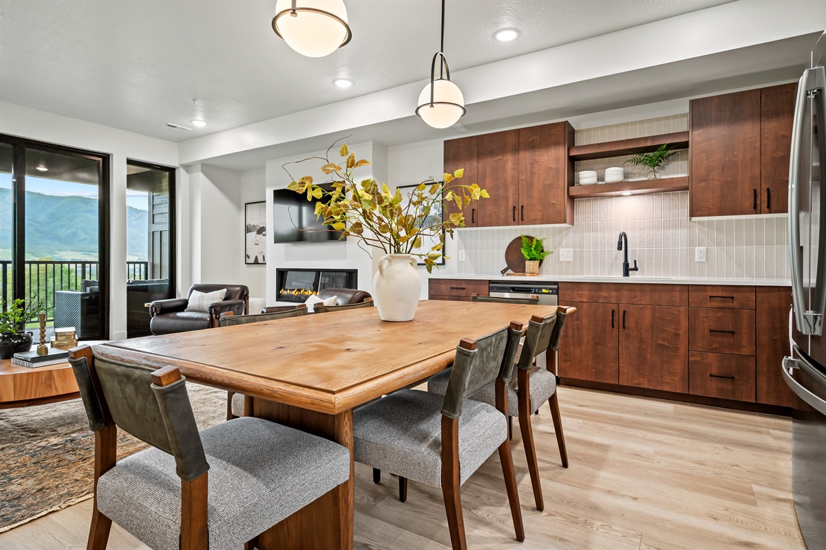 Enjoy meals with mountain views — the kitchen flows seamlessly into the dining and living spaces.