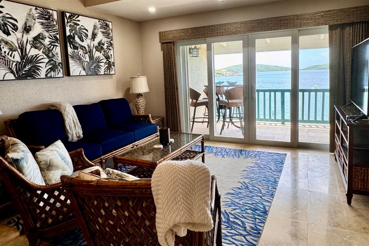 The oceanfront great room living area overlooks the yacht club moorings. 