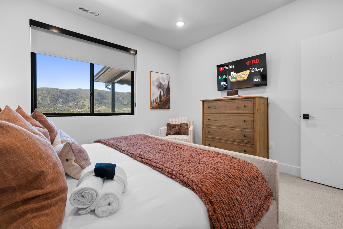 Main-level king bedroom with beautiful valley views and Smart TV.