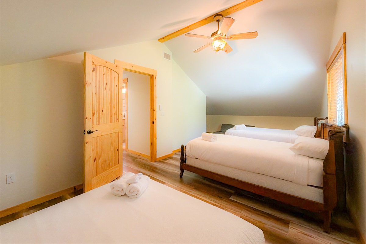 1 Queen and two twin beds in the Caboose themed room. Perfect for the kiddos!