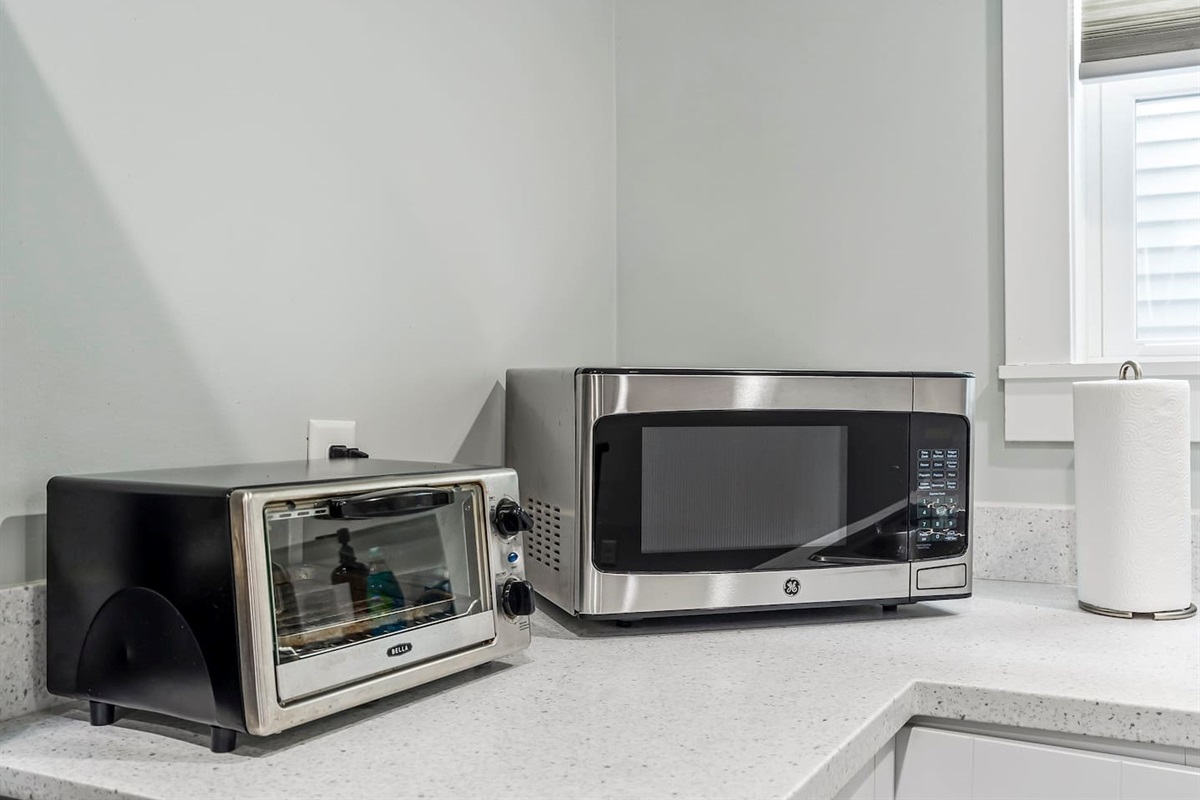Fully equipped kitchen details including small appliances and prep space, designed for both short and extended stays.