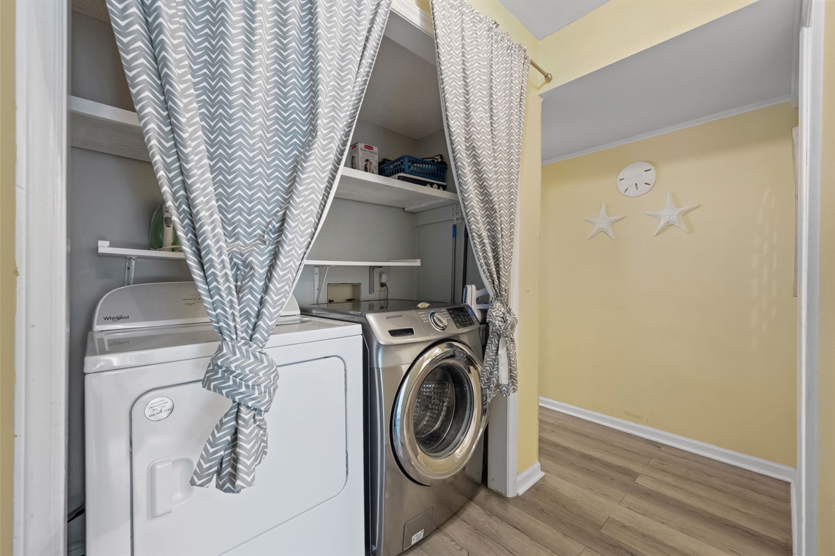 In-unit washer and dryer tucked just off the hallway so you can keep beach towels and clothes fresh during your stay