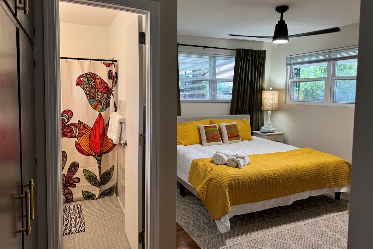 Big, comfy  king sized bed connects to the bathroom