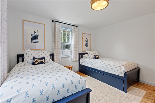 A Serene Haven with 2 Twin Beds and 1 Trundle, where warmth embraces you!