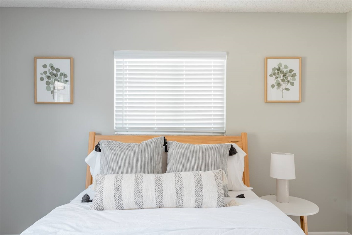 Primary bedroom with queen bed and private full bath