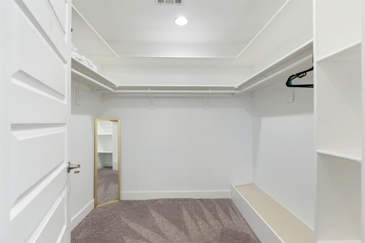 Spacious closet offering ample storage for clothing, ensuring an organized and tidy living space.