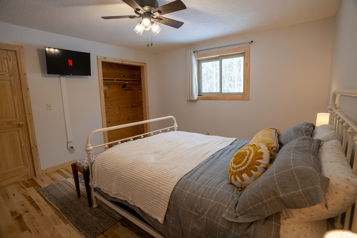 The second bedroom downstairs features a queen bed, smart TV and plenty of room to spread out.  