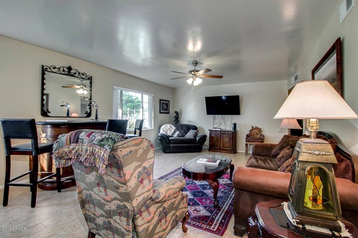 Spacious open- concept living room with plenty of seating. 