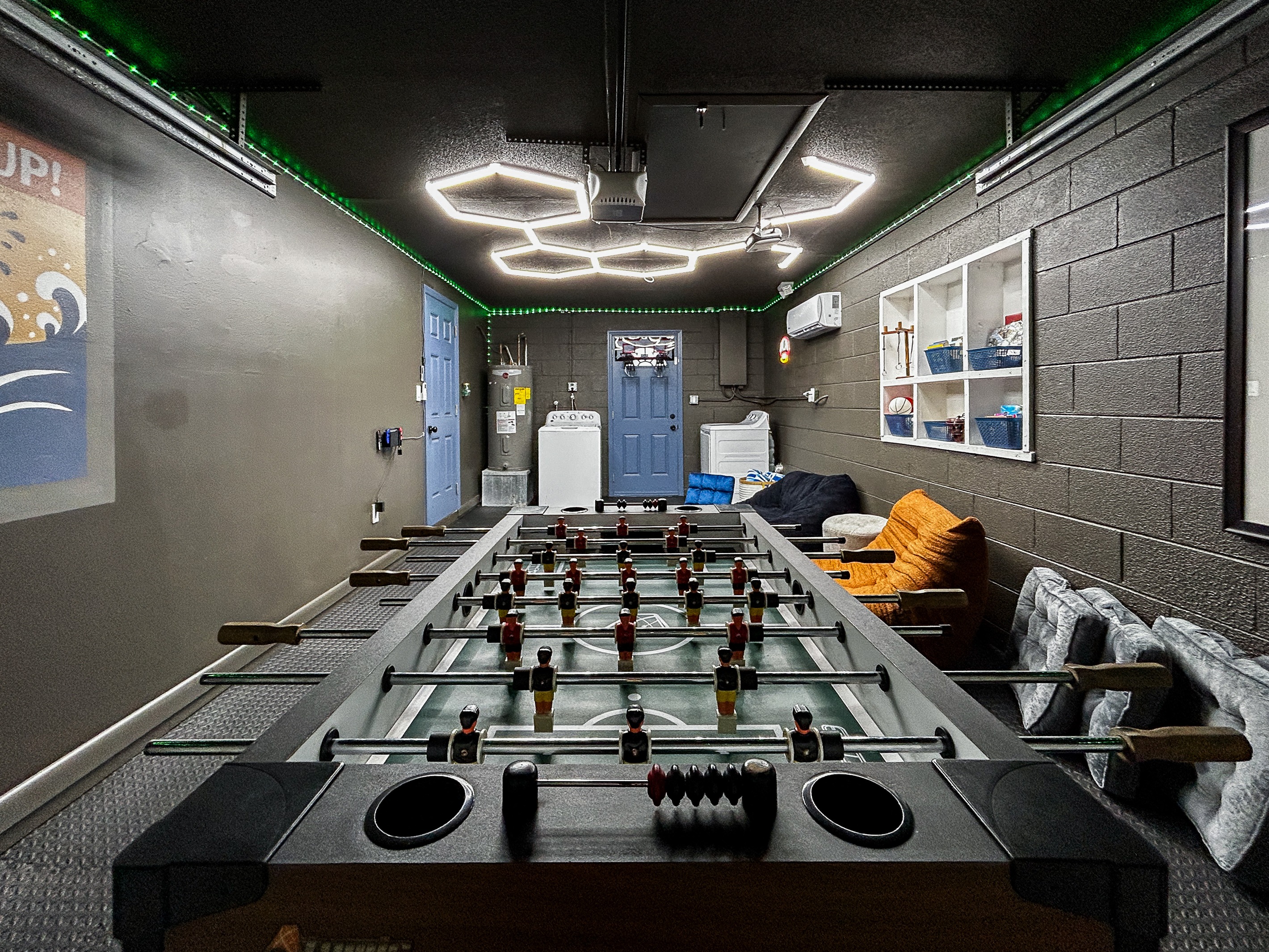 Garage Game Room Air Conditioned with Foosball, Nintendo Switch with Mario Kart, Comfortable Seating, Foam Mat Flooring, LED Lights, Mini Basketball, Games, Books & More