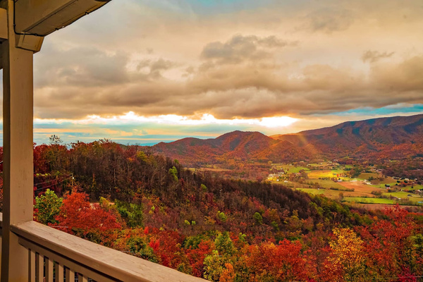 Front balcony view of Wears Valley, glowing at sunset, Tanasi Lodge