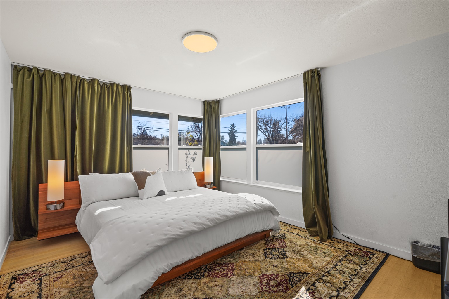 Spacious primary bedroom featuring a comfortable king bed, Smart TV, and plenty of room to relax after a day exploring Napa Valley.