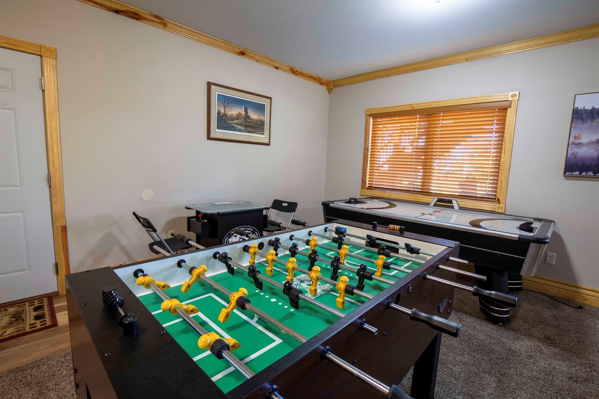 Challenge your crew to a friendly foosball match or an air hockey showdown in this cozy game room!