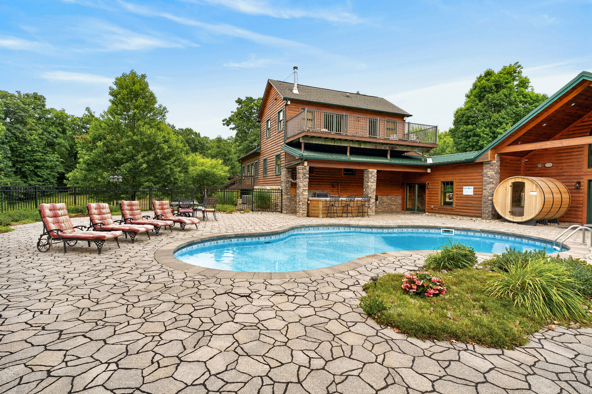 Pool and log cabin exterior