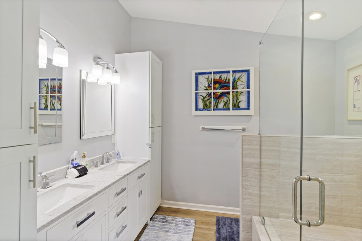 Unpack for the week &mdash; the master bath has the space, the storage, and the double sinks to make it easy.