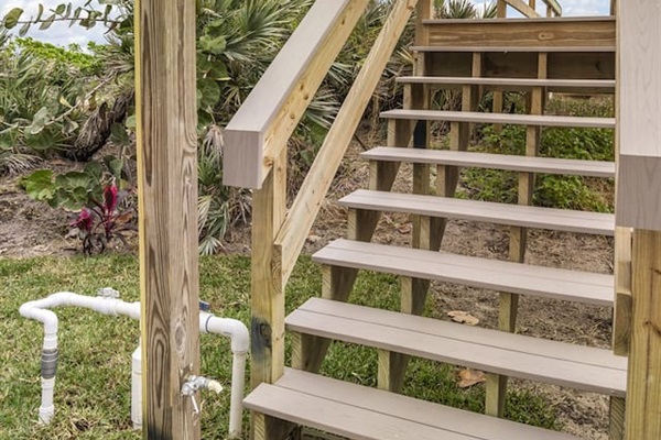 Experience the charm of the house's exterior, featuring a beautifully designed wooden bridge that adds a rustic yet elegant touch, leading you toward the tranquil surroundings and inviting atmosphere of the property.