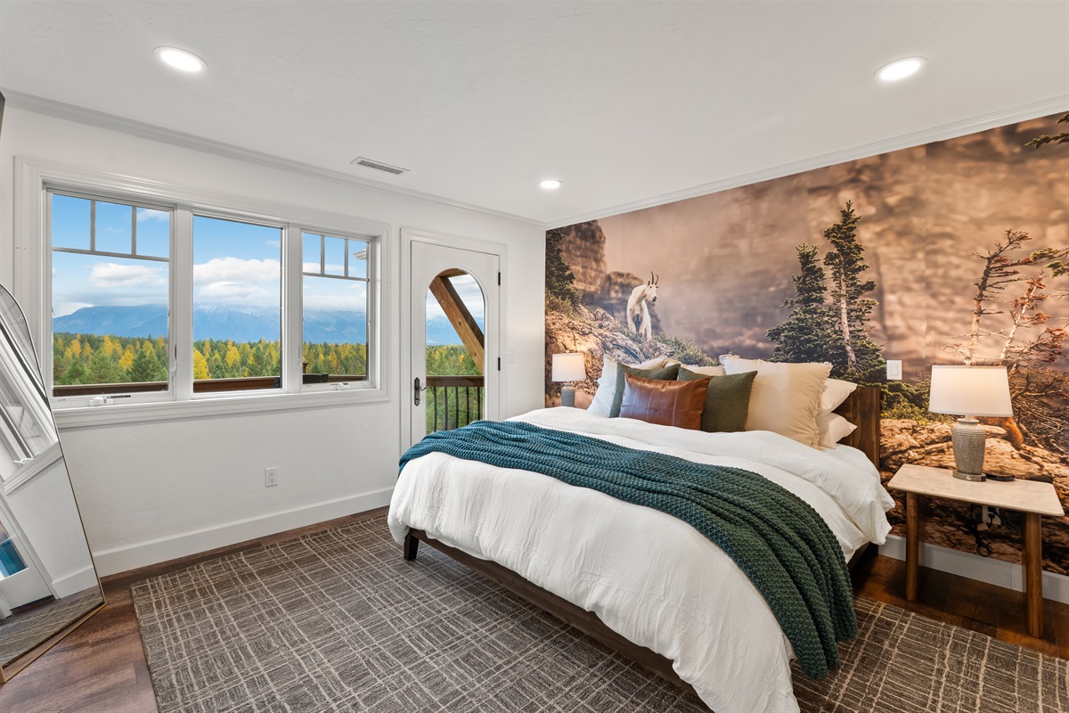 Bedroom #3 upstairs - perfectly complemented by the mountain goat mural.