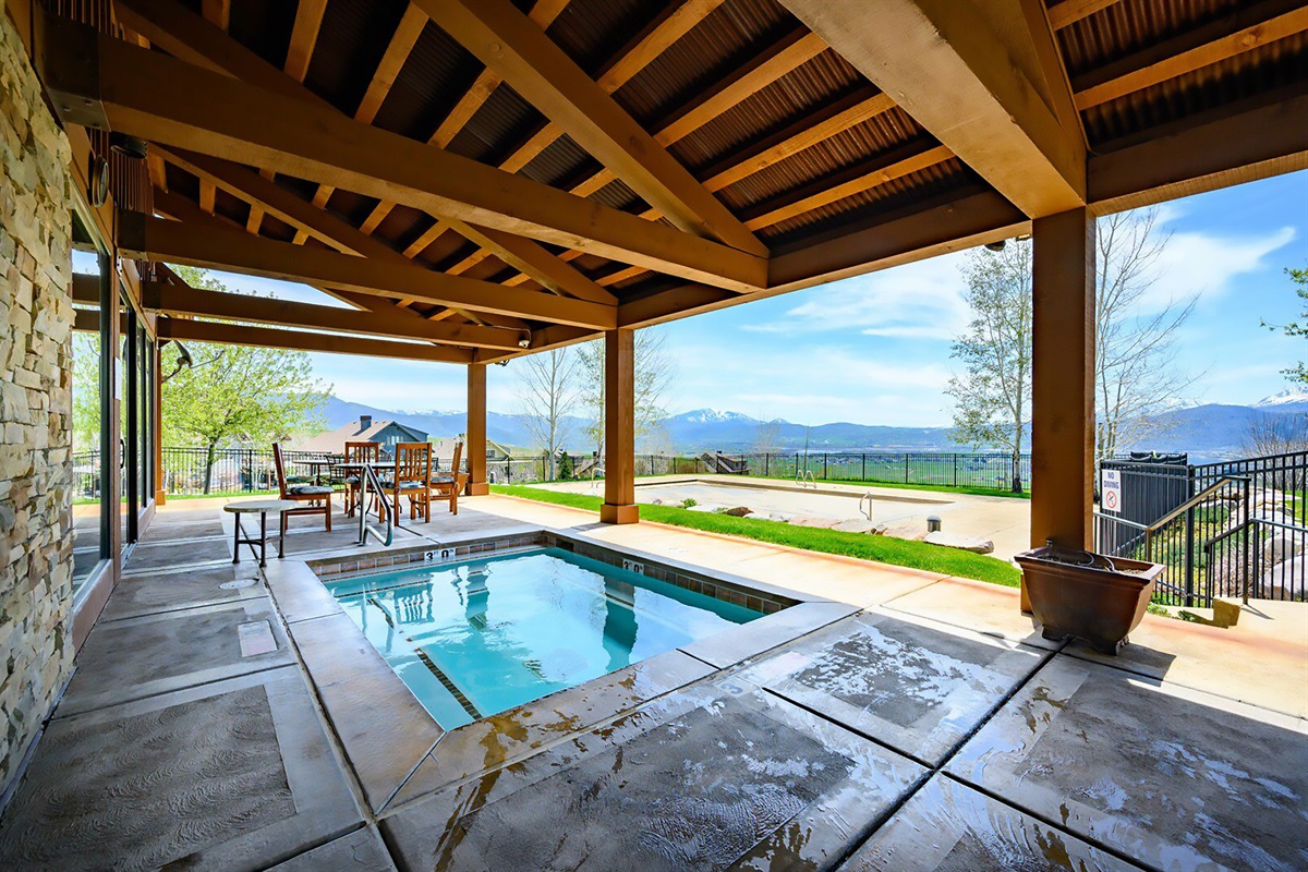 Unwind in the community covered hot tub, offering incredible views and year-round relaxation.