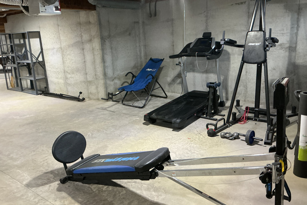Gym equipment area in basement