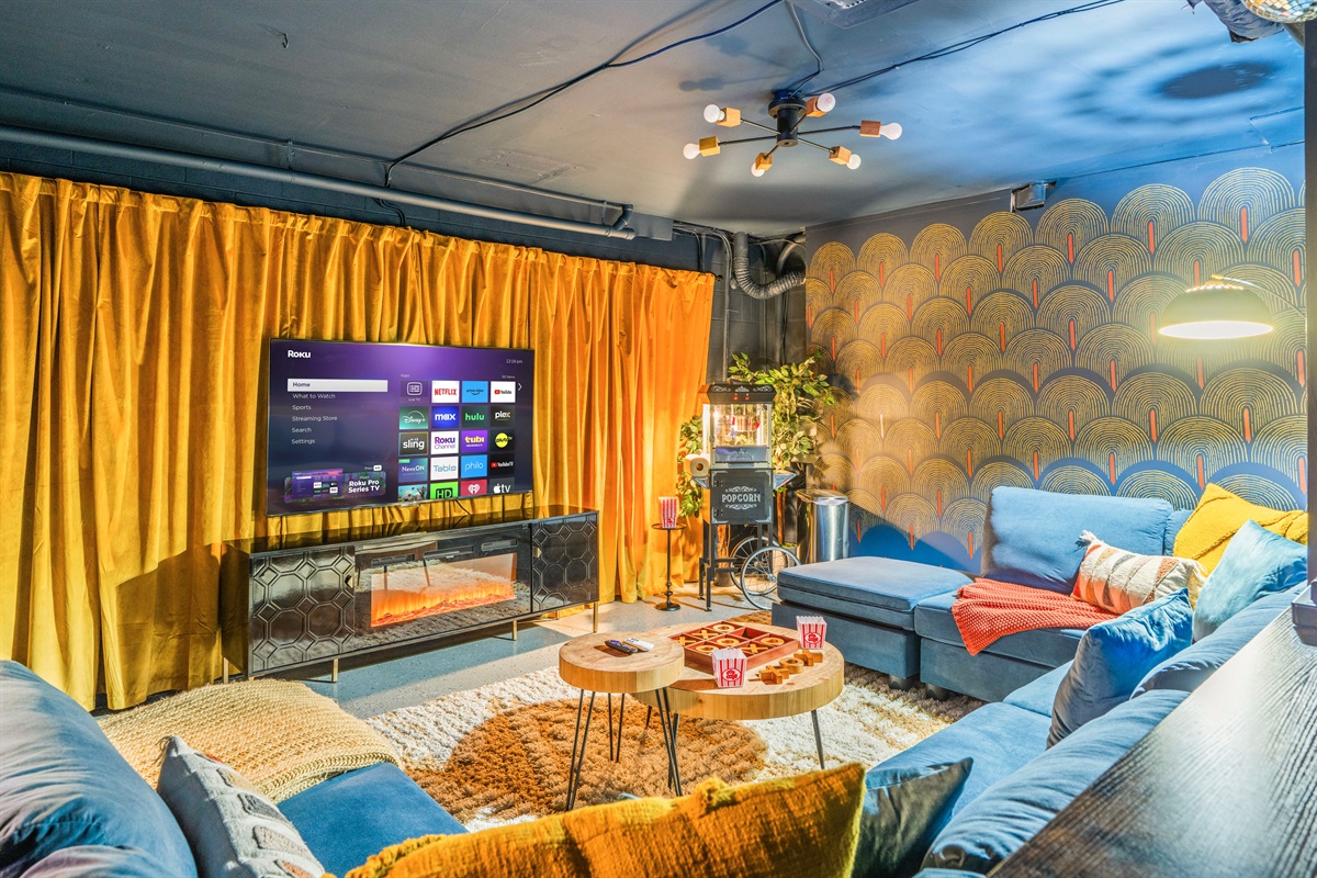 🎬 Why go to the movies when you have a private theater? Enjoy a cozy sofa for 10, a 65-inch smart TV, and an old-fashioned popcorn machine—all for the perfect movie night!