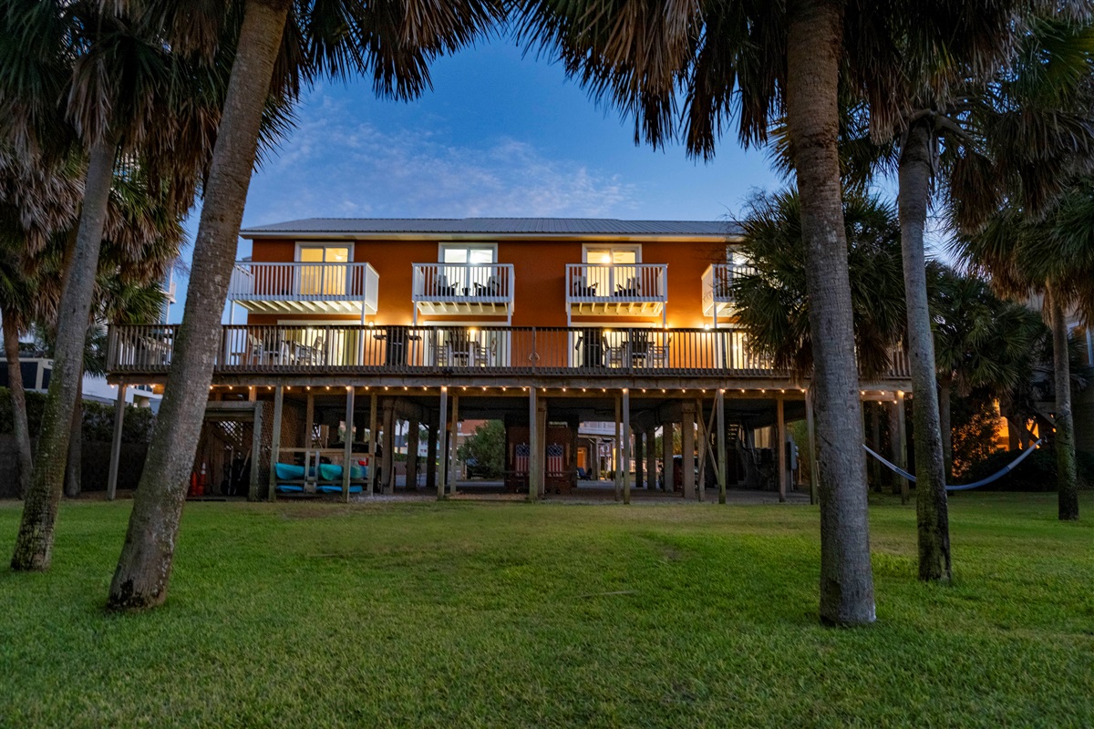 Cozy “Just Beachy” getaway with tropical vibes and glowing evening ambiance in Gulf Shores, AL