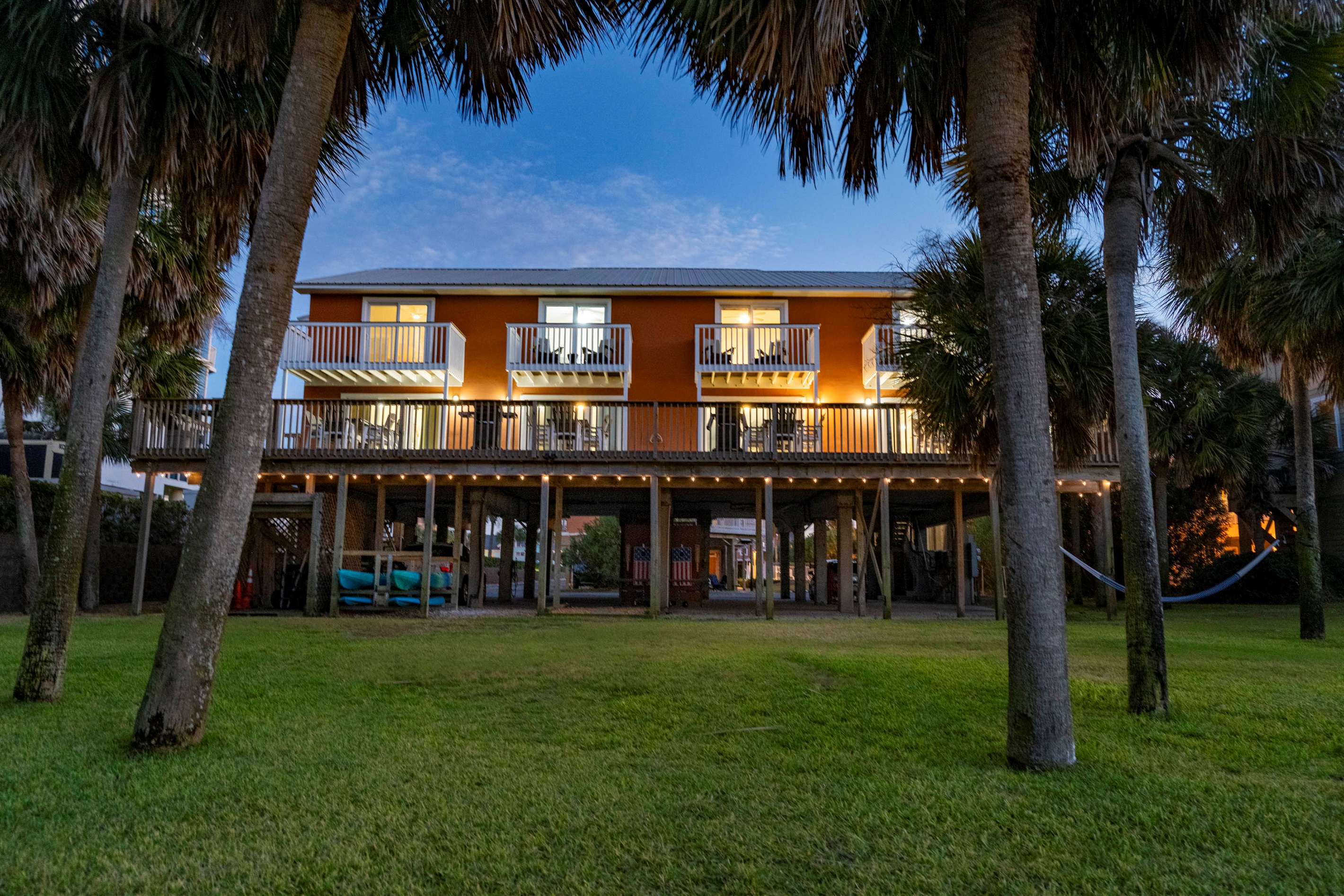 Cozy “Just Beachy” getaway with tropical vibes and glowing evening ambiance in Gulf Shores, AL