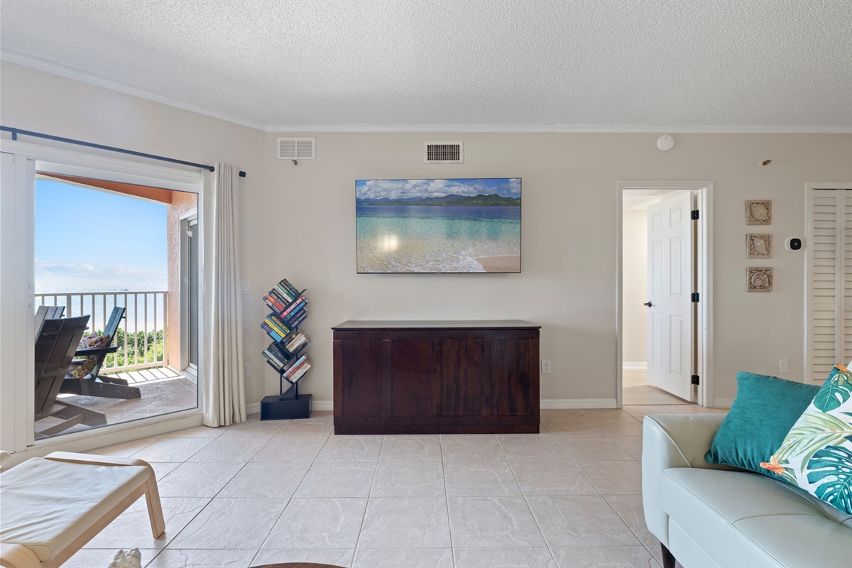 Living Room (w/ Queen murphy bed) with gulf views and patio access.