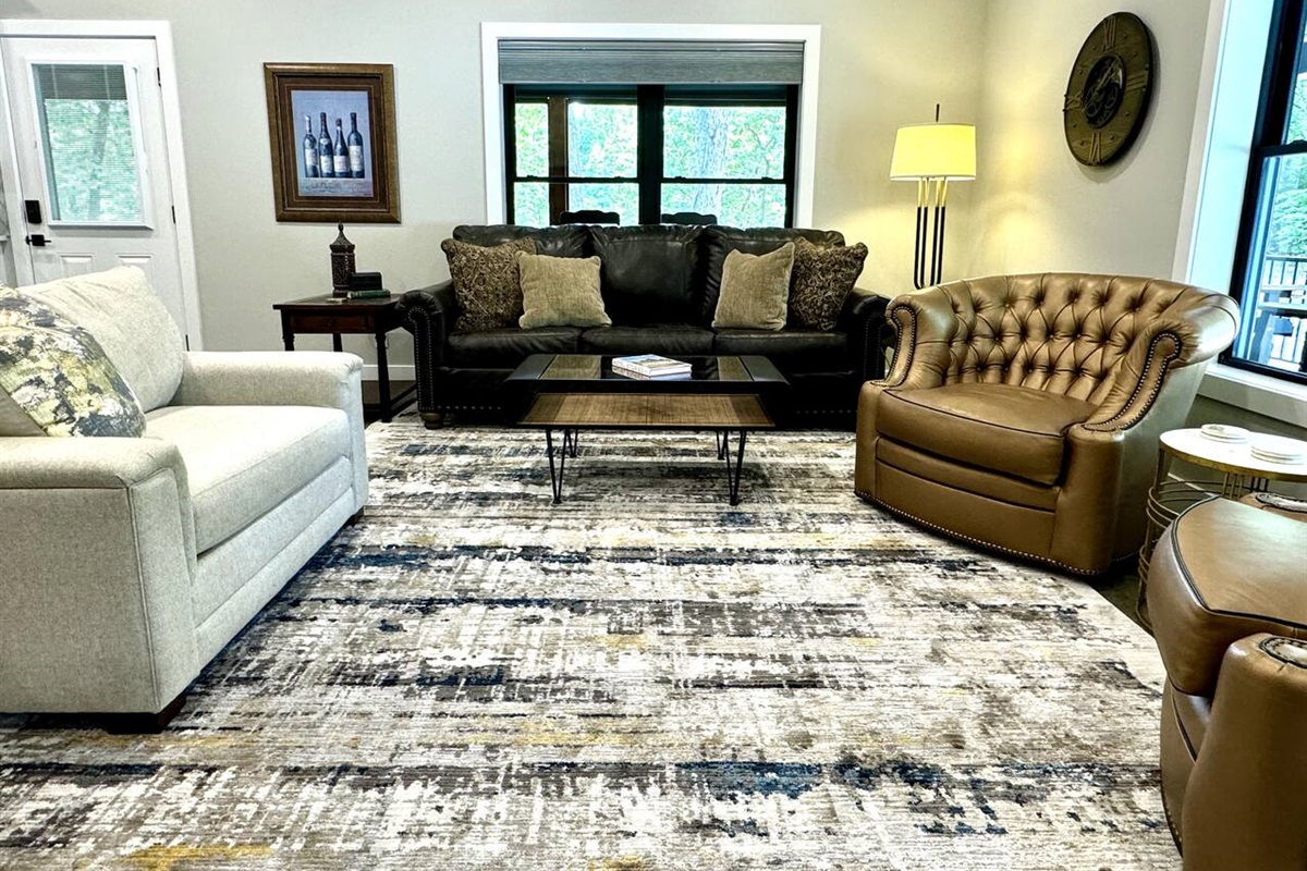 Spacious living room seating with real leather couch and chairs.