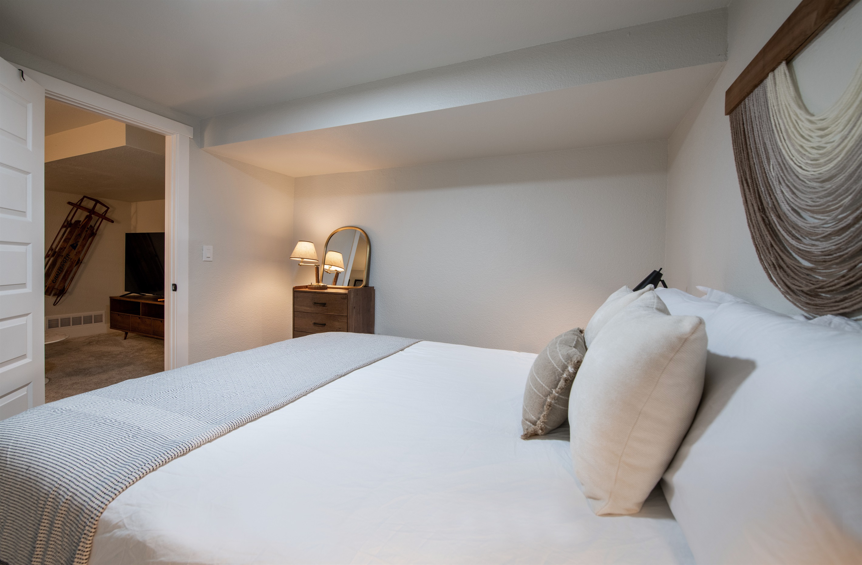 View to theater room from bedroom 5, another queen bedroom with same luxury bed linens and mattress as the rest