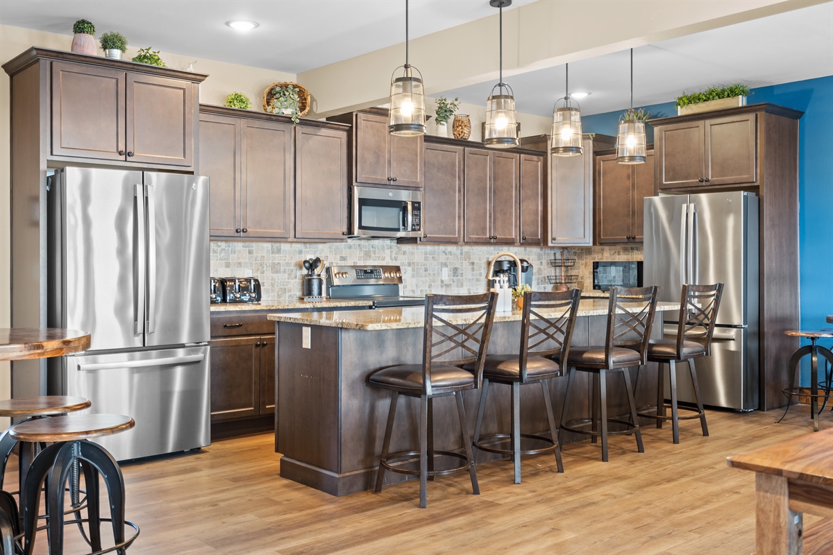  Spacious open kitchen with large island seating, perfect for cooking and gathering with family and friends