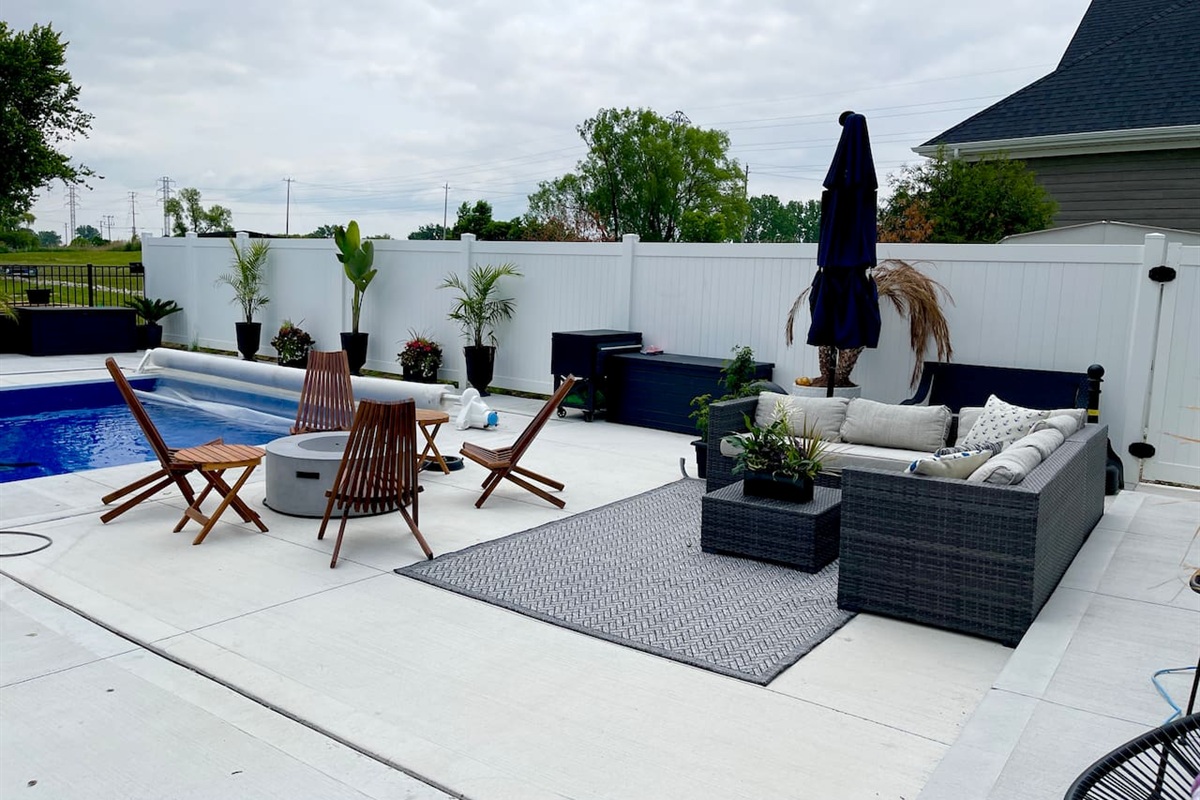 Pool sitting area with fireplace