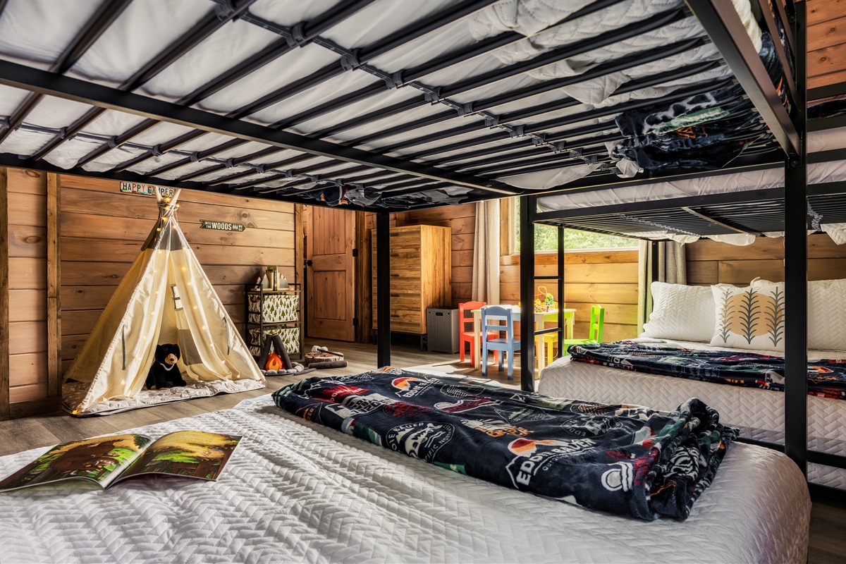 Family-friendly kids room with bunk beds, toy table, and cheerful vibes.