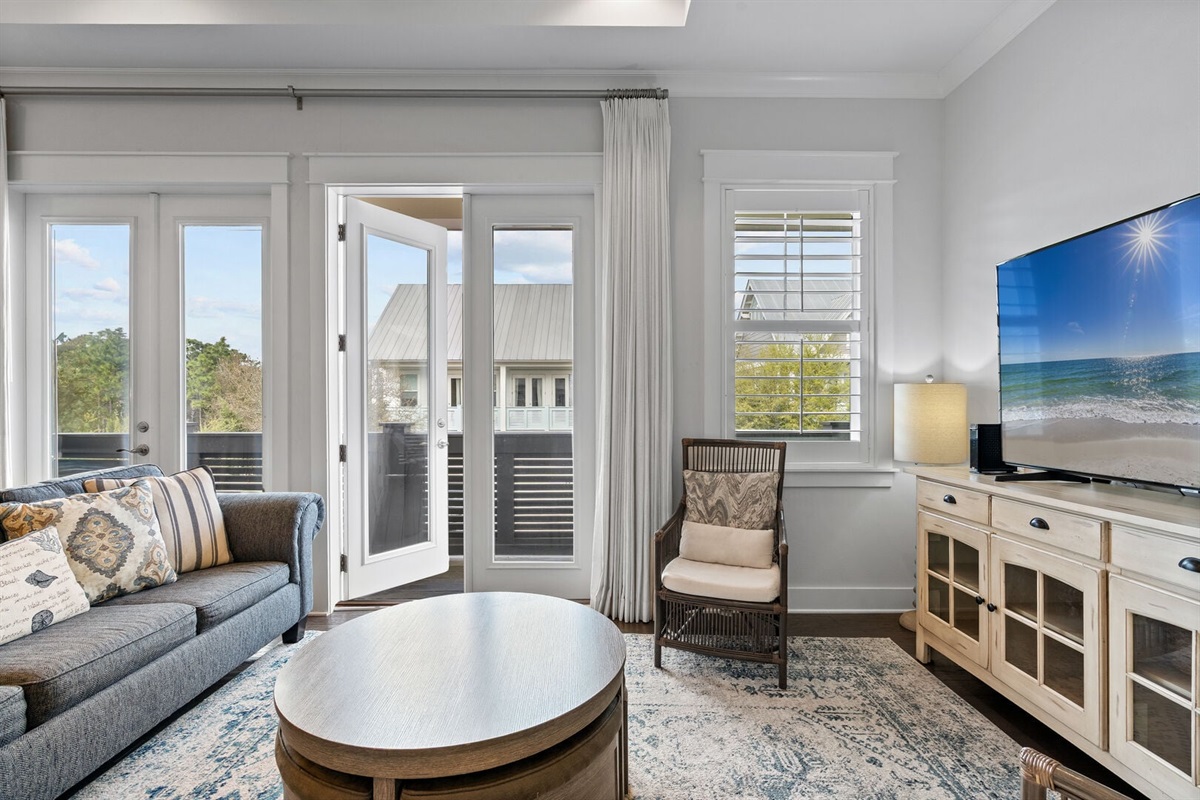 Queen sofa sleeper with balcony access.