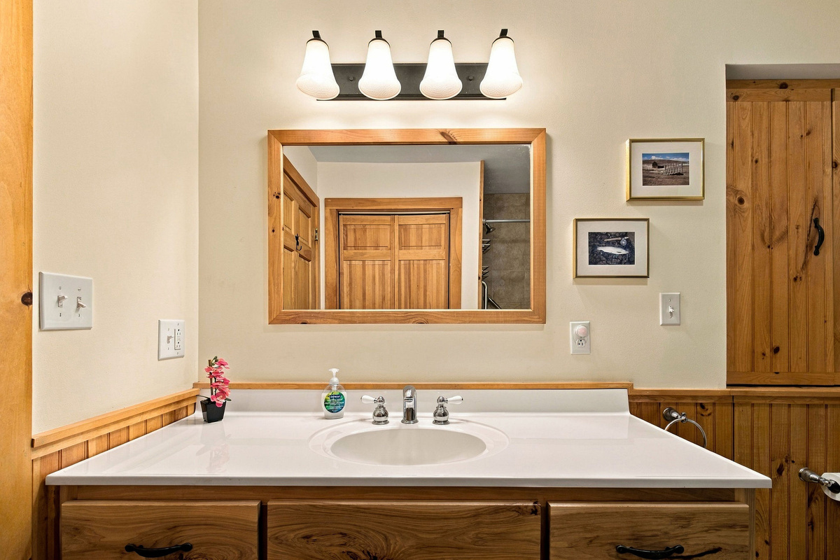 The spacious primary bathroom vanity offers plenty of counter space for getting ready.